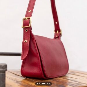 Coach vintage Red Leather Shoulder Bag with Gold Accents.